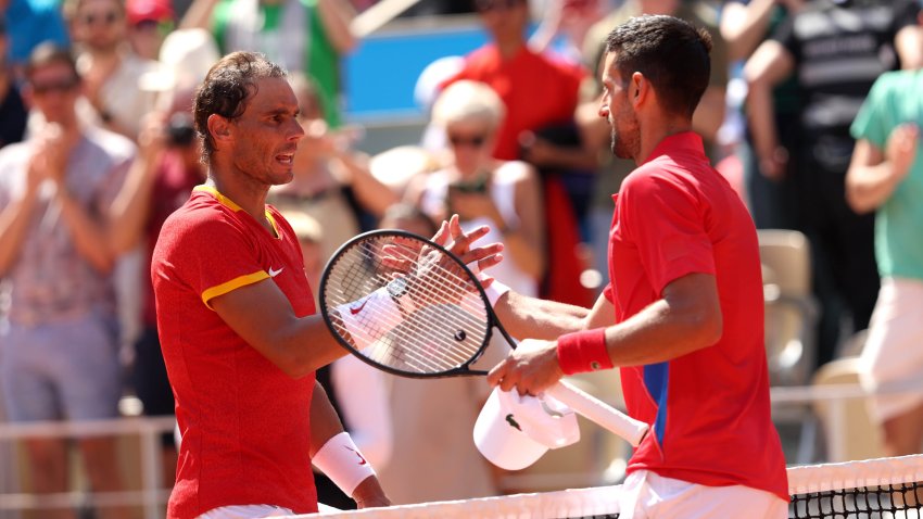 Winner Novak Djokovic of Team Serbia (R) is congratulated by Rafael Nadal of Team Spain