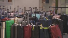 Luggage is seen lined up at Boston Logan International Airport on Tuesday, July 23, 2024.