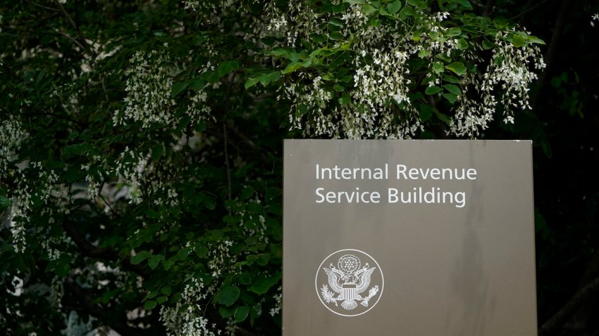 FILE – A sign for the Internal Revenue Service building in Washington, May 4, 2021. The IRS plans to end another major tax loophole that could raise more than $50 billion in revenue over the next decade, the U.S Treasury says.