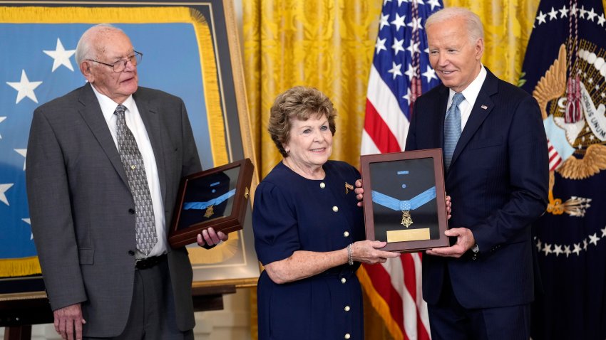 President Joe Biden presents the Medal of Honor to Theresa Chandler, the great great granddaughter of Pvt. George D. Wilson in the East Room at the White House in Washington, Wednesday, July 3, 2024. The medals posthumously honor two U.S. Army privates who were part of a daring Union Army contingent that stole a Confederate train during the Civil War. U.S. Army Pvts. Philip G. Shadrach and George D. Wilson were captured by Confederates and executed by hanging. At left is Gerald Taylor, the great great nephew of Pvt. Philip G. Shadrach.