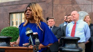 Lead plaintiff Kayla Gore speaks at a news conference outside the federal courthouse in Nashville, Tenn., April 23, 2019.