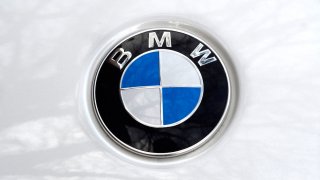 The hood emblem on a BMW automobile parked in Santa Fe, New Mexico.