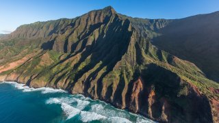 File. Pacific Ocean waves break on the Na Pali Cliffs in the Na Pali Coast State Park on Kauai, Hawaii.