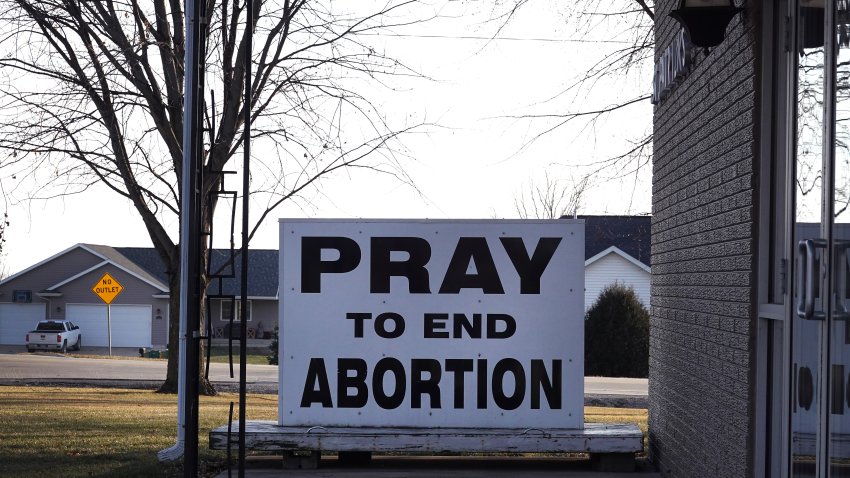 WINTHROP, IOWA – DECEMBER 20: An anti-abortion sign sits in front of St. Patrick’s Catholic Church on December 20, 2023 in Winthrop, Iowa. Republican presidential candidates are currently criss-crossing Iowa as the states January 15 Republican caucus draws near. (Photo by Scott Olson/Getty Images)