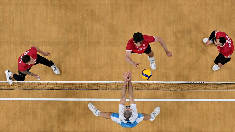 An overview shows Slovenia's Alen Pajenk (bottom) fighting for the ball with Canada's Arthur Szwarc (top left), Fynnian Lionel Mccarthy (top center) and Stephen Timothy Maar (top right)