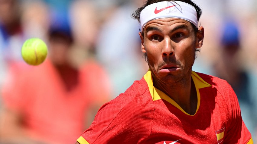 Spain’s Rafael Nadal eyes the ball as he returns to Serbia’s Novak Djokovic during their men’s singles second round tennis match on Court Philippe-Chatrier at the Roland-Garros Stadium at the Paris 2024 Olympic Games, in Paris on July 29, 2024. (Photo by Martin  BERNETTI / AFP) (Photo by MARTIN  BERNETTI/AFP via Getty Images)