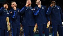 Team USA poses with their bronze medal during the podium ceremony for the artistic gymnastics men's team final