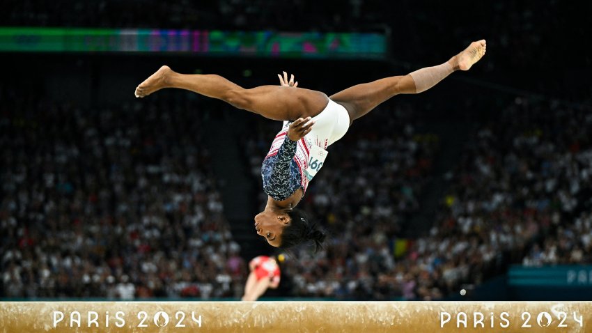 The U.S.’ Simone Biles competes in the balance beam event of the artistic gymnastics women’s team final during the Paris 2024 Olympic Games at the Bercy Arena in Paris, on July 30, 2024. (Photo by GABRIEL BOUYS/AFP via Getty Images)