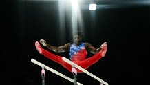 Frederick Richard, of Stoughton Massachusetts, competes in the parallel bars event of the artistic gymnastics men's all-around final at the Bercy Arena on Wednesday, July 31, 2024, during the Paris 2024 Olympic Games. (Photo by Loic VENANCE / AFP) (Photo by LOIC VENANCE/AFP via Getty Images)