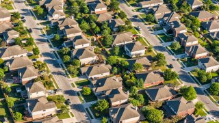 San AntonioTexas suburban housing development neighborhood – aerial view with houses in rows in middle-class neighborhood