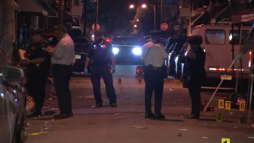 Police investigate after a mass shooting at a party at Alden Street and Girard Avenue in West Philadelphia left three people dead early Sunday.