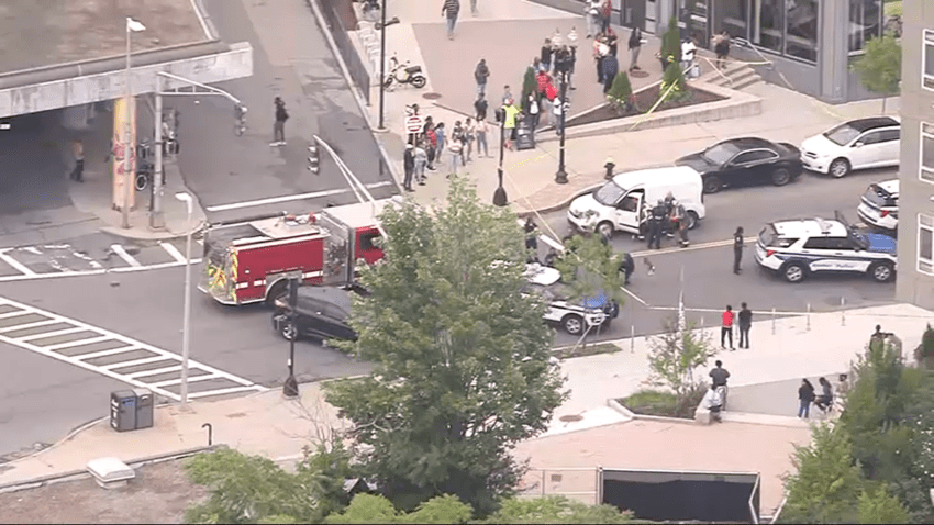 First responders at the scene of a daylight shooting near an Orange Line stop in Boston's Jamaica Plain neighborhood on Monday, July 29, 2024.