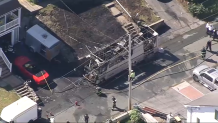 A charred RV in Peabody, Massachusetts, on Tuesday, July 2, 2024.