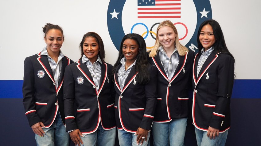 Hezly Rivera, Jordan Chiles, Simone Biles, Jade Carey & Suni Lee from the U.S. women’s gymnastics team pose in their Opening Ceremony attire.