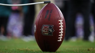 A general view of an NFL football on a kicking tee