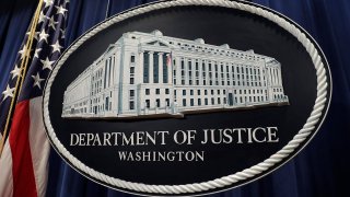 The U.S. Department of Justice seal is displayed in Washington, D.C.