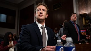 Mark Zuckerberg, chief executive officer of Meta Platforms Inc., center, arrives following a break during a Senate Judiciary Committee hearing in Washington, DC, US, on Wednesday, Jan. 31, 2024.