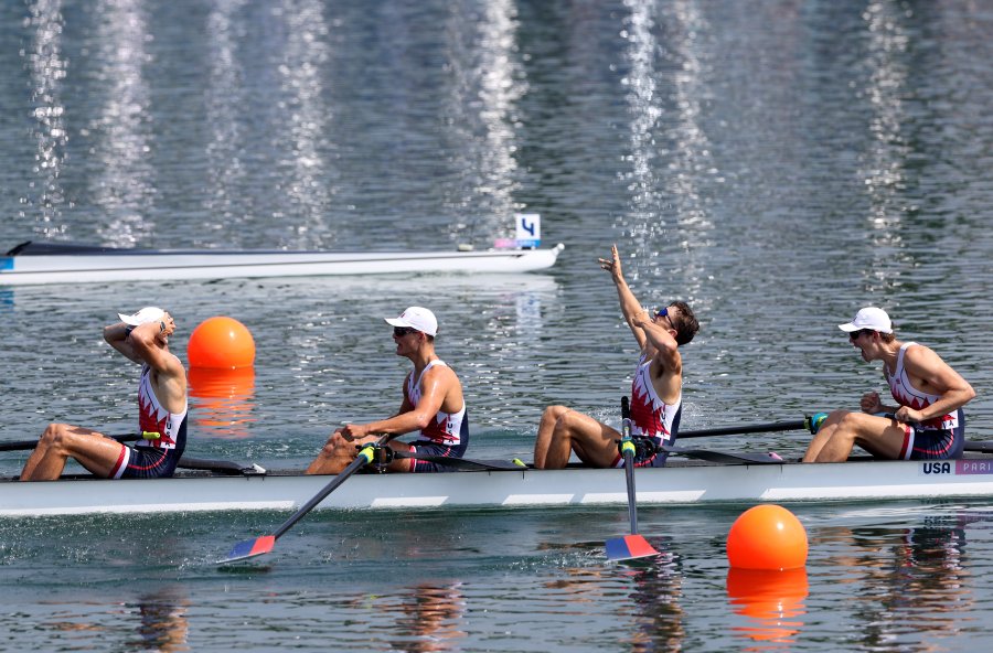 Nick Mead, Justin Best, Michael Grady and Liam Corrigan of Team United States celebrate winning the gold medal