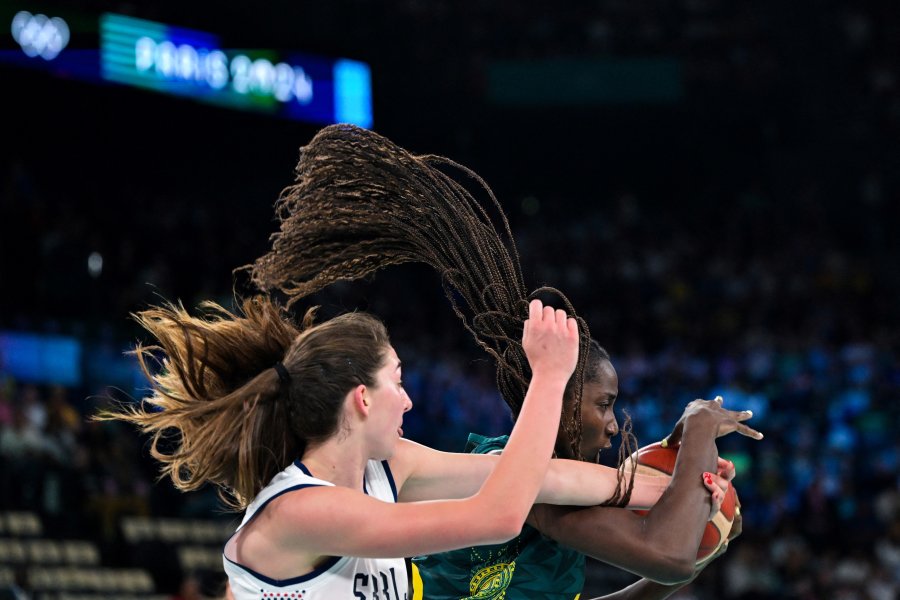 Australia's #13 Ezi Magbegor fights for the ball in the women's quarterfinal basketball match between Serbia and Australia during the Paris 2024 Olympic Games at the Bercy Arena in Paris on August 7, 2024