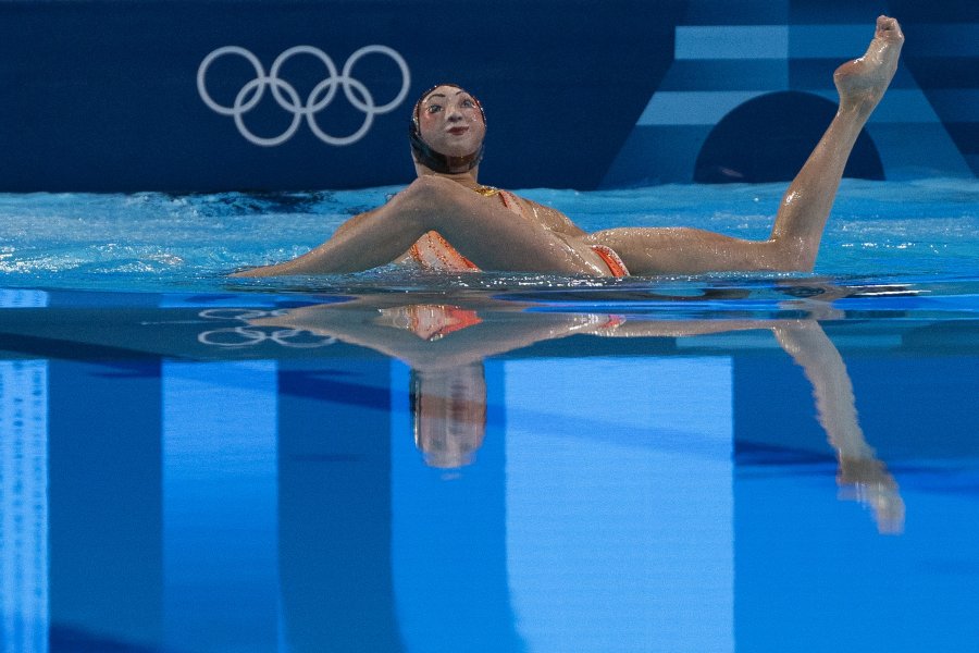 Athletes perform their routine during the artistic swimming competition