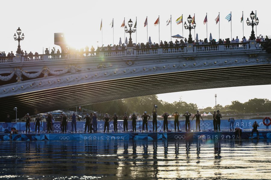 Athletes line up at the start before diving into the Seine river to compete in the women's 10km marathon swimming final at the Paris 2024 Olympic Games at Pont Alexandre III bridge in Paris on August 8, 2024