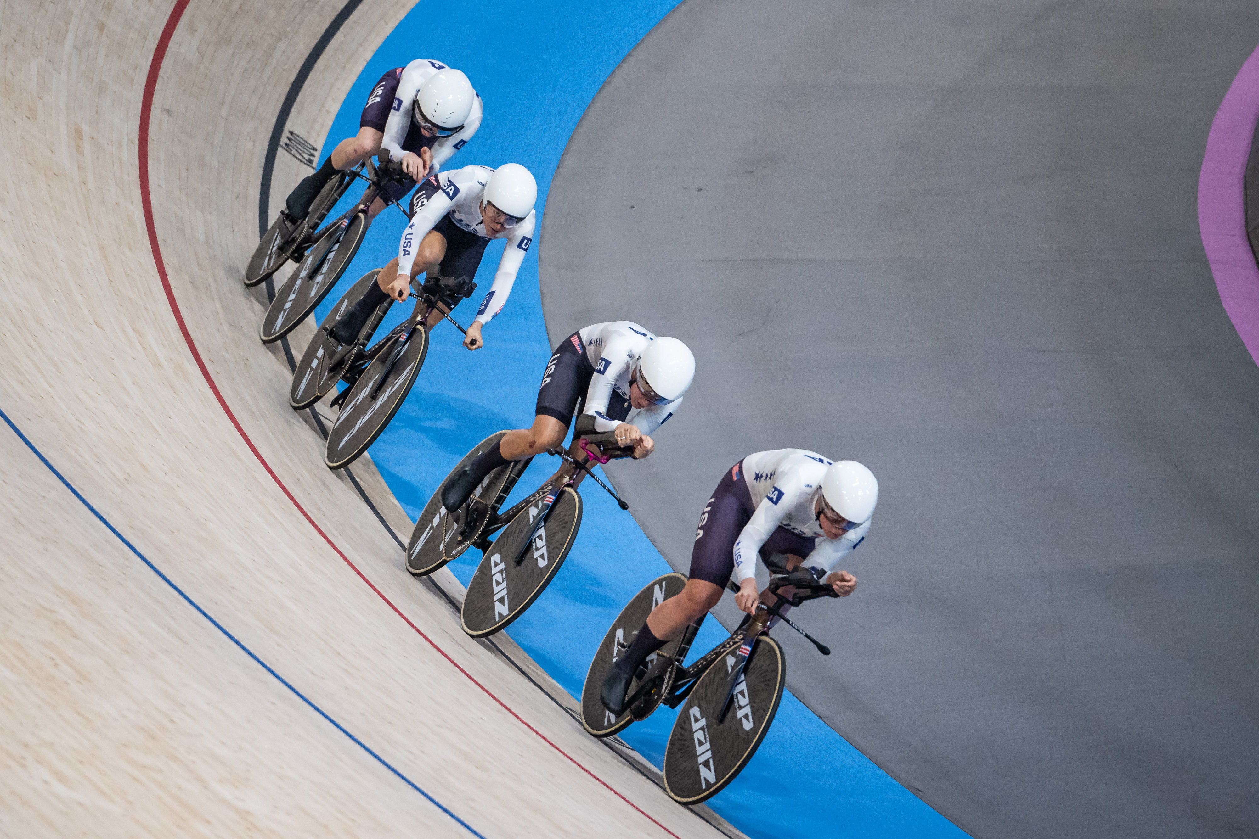 Jennifer Valente, Lily Williams, Chloe Dygert and Kristin Faulkner of Team United States compete during a women's team pursuit race at the Paris Olympics