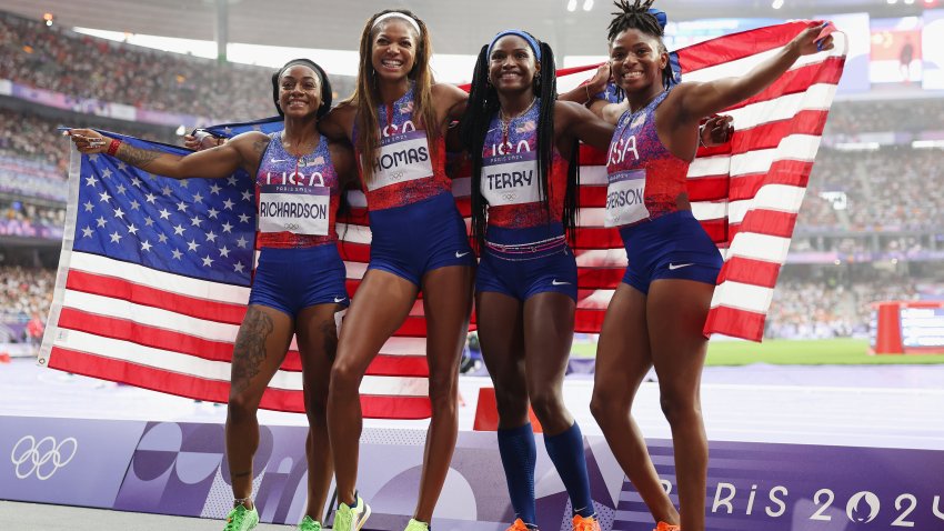 The U.S. women's 4x100-meter relay team celebrating their gold medal at the Paris Olympics on Friday, Aug. 9, 2024.