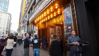 BOSTON, MA – OCTOBER 11: Patrons gather and ushers protest on the final night for the Emerson Colonial Theatre in Boston on Oct. 11, 2015.