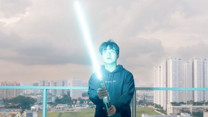 Jacob Uy stands with his real life retractable lightsaber