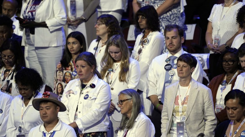 Aug 22, 2024; Chicago, IL, USA; Attendees wear white during the final day of the Democratic National Convention at the United Center. Mandatory Credit: Jasper Colt-USA TODAY