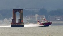 A fire boat in Boston Harbor after an accident that left three people hurt on Tuesday, Aug. 6, 2024.