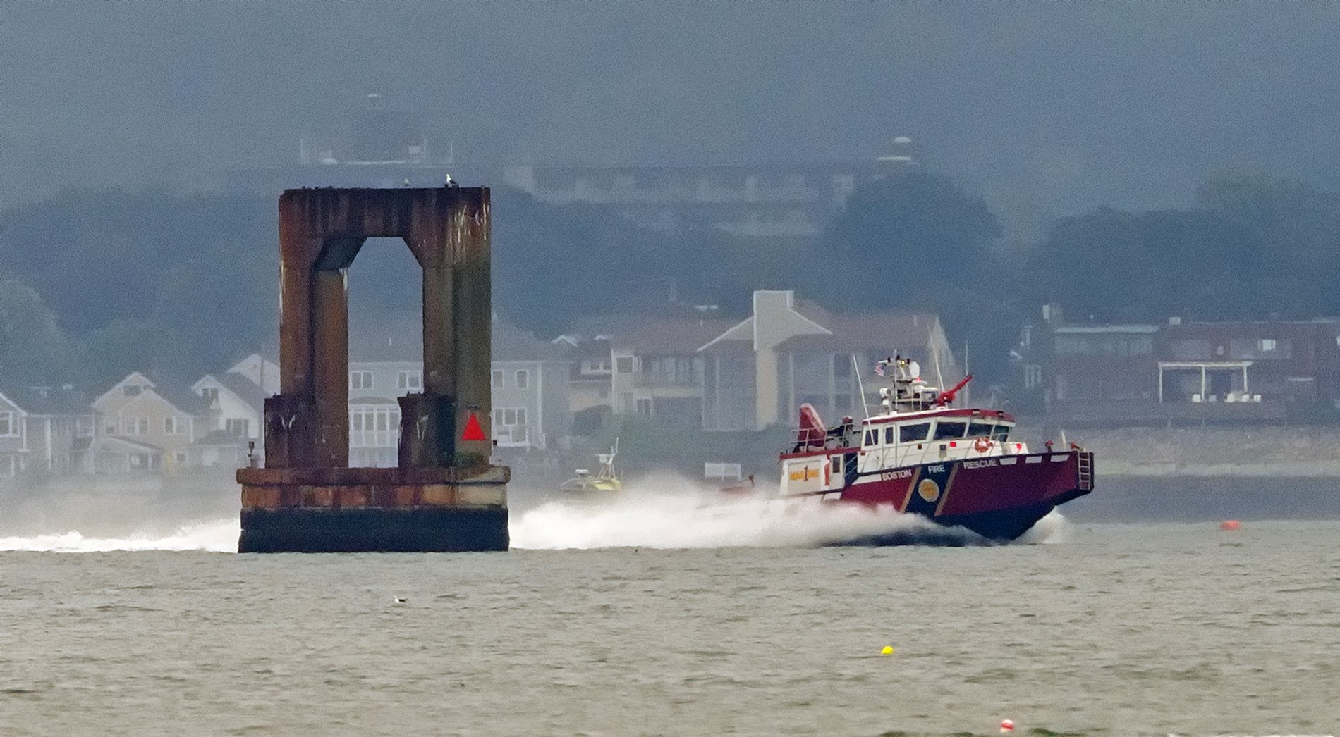 A fire boat in Boston Harbor after an accident that left three people hurt on Tuesday, Aug. 6, 2024.