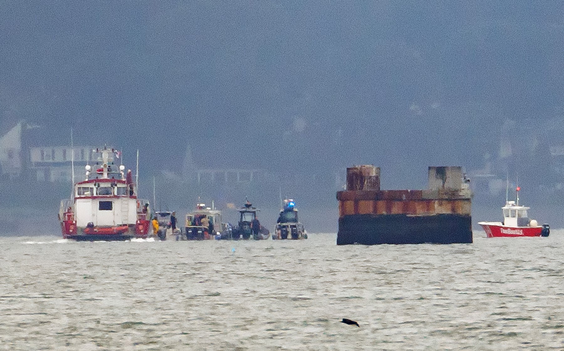 First responders' boats in Boston Harbor after an accident that left three people hurt on Tuesday, Aug. 6, 2024.