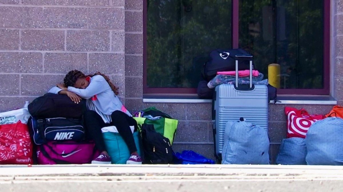 Migrants sleep outdoors at the Wollaston T-Station in Quincy, MA – NBC Boston