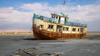 A ship stranded in the growing salt flats of Lake Urmia in Iran.