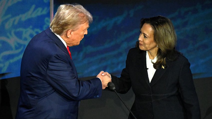 Vice President and Democratic presidential candidate Kamala Harris (R) shakes hands with former President and Republican presidential candidate Donald Trump during a presidential debate at the National Constitution Center in Philadelphia on Sept. 10, 2024.