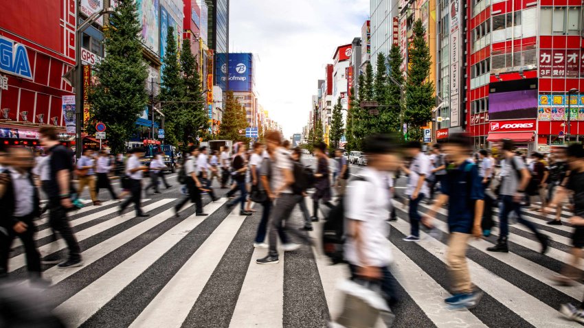 People crossing street in Tokyo’s busy Akihabara downtown area