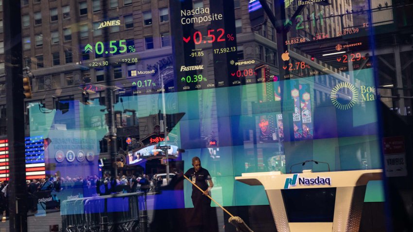 A worker sweeps the floor at the Nasdaq MarketSite in New York, US, on Monday, Sept. 16, 2024.