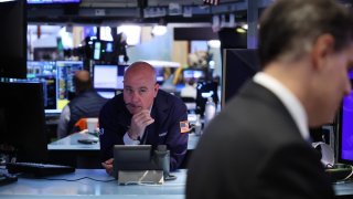 Traders work on the floor of the New York Stock Exchange during morning trading on September 23, 2024 in New York City.