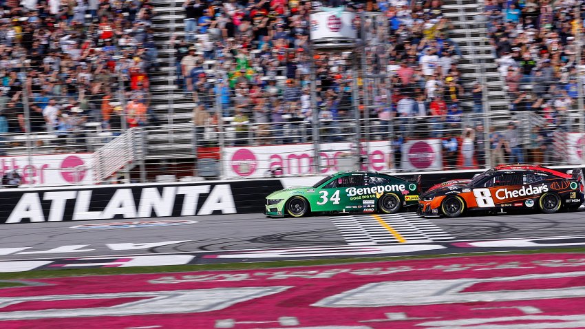 Michael McDowell, driver of the No. 34 Benebone Ford, leads Kyle Busch, driver of the No. 8 Cheddar's Scratch Kitchen Chevrolet