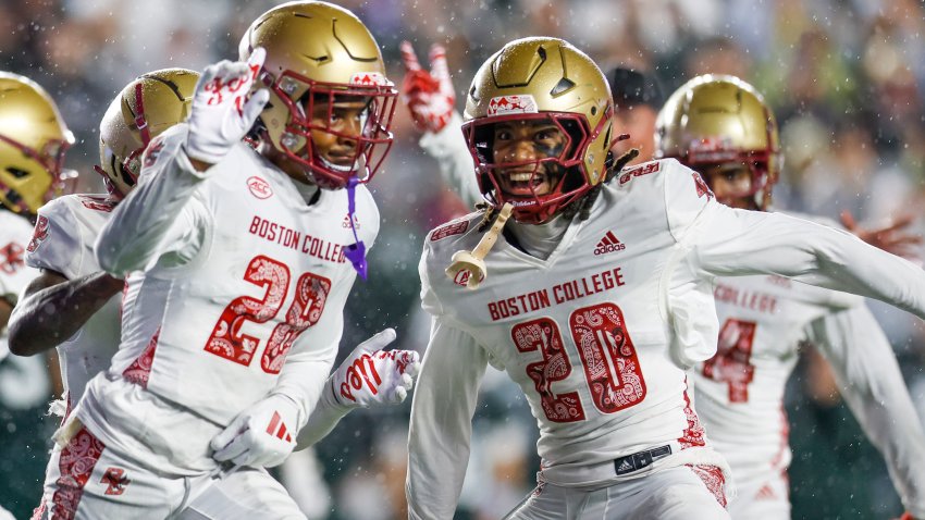 Boston College defensive back Carter Davis (28) and defensive back KP Price (20) celebrate after a third down stop during the first half of an NCAA football game against Michigan State on Saturday, Sept. 21, 2024, in Chestnut Hill, Mass. (AP Photo/Greg M. Cooper)