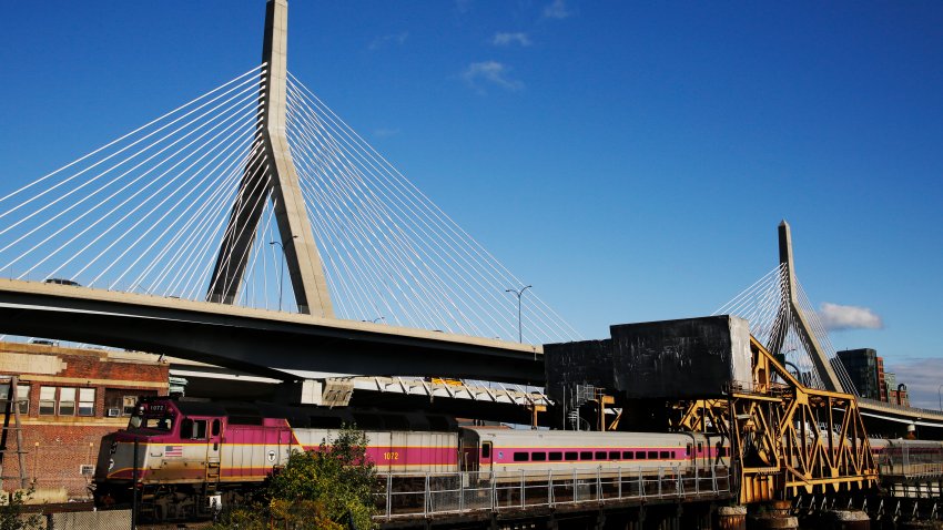 An MBTA Commuter Rail train passes over a drawbridge in Cambridge, MA on Oct. 12, 2018.