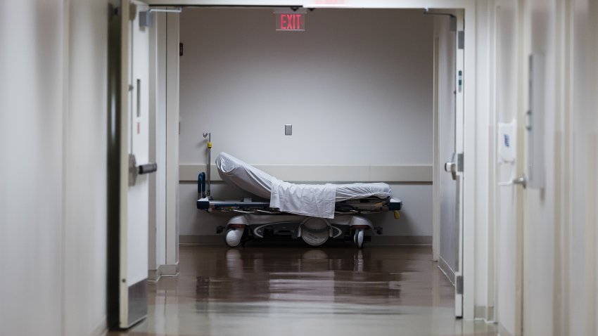 A hospital gurney in a hallway at Freeman Hospital West in Joplin, Missouri, U.S., on Tuesday, Aug. 3, 2021. Hospitals in states where Covid-19 cases are once again surging are beginning to feel the strain in their emergency departments and intensive care units. Photographer: Angus Mordant/Bloomberg via Getty Images