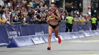 BOSTON, MASSACHUSETTS – APRIL 15: Sara Hall of the United States crosses the finish line during the 128th Boston Marathon on April 15, 2024 in Boston, Massachusetts. (Photo by Paul Rutherford/Getty Images)