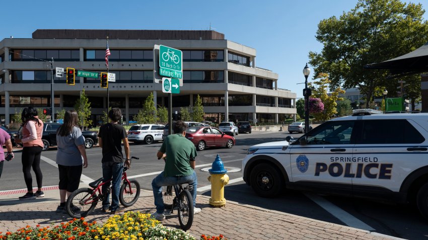 People watch as Springfield Police Department