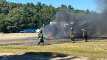 Firefighters at the scene of a truck fire on I-93 in Canton, Massachusetts, on Tuesday, Sept. 3, 2024.