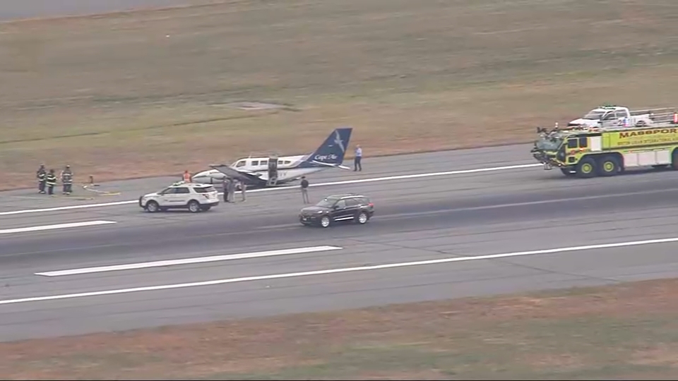 A Cape Air plane surrounded by first responders at Boston Logan International Airport on Tuesday, Sept. 17, 2024.