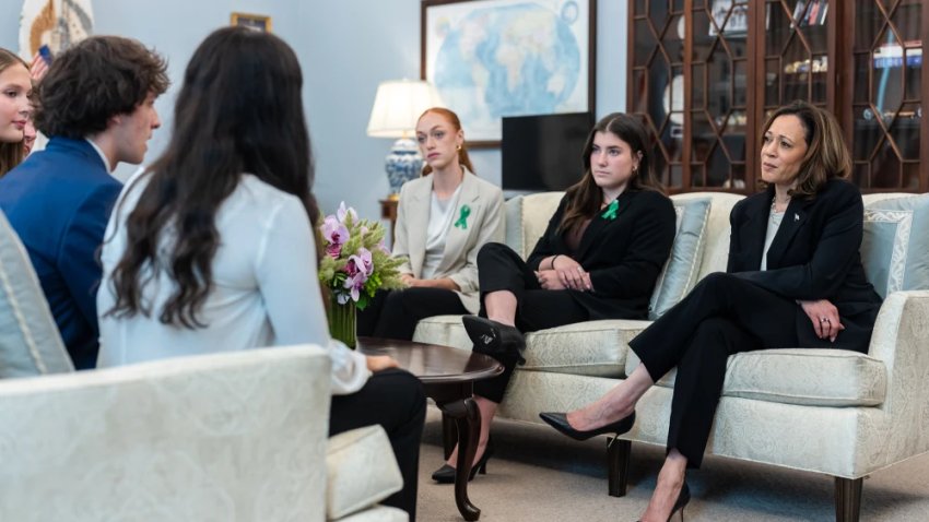 Graduating seniors who formerly attended Sandy Hook Elementary School in Newtown, Conn., speak with Vice President Kamala Harris at the White House on June 6.