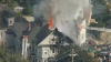 Large fire burning in Lowell, video footage shows roof collapse