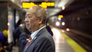 MBTA General Manager Phil Eng waits on a North Station platform.